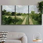 Three-panel canvas wall art featuring meadow trail through open grassland, displayed in a modern living room above a sofa.
