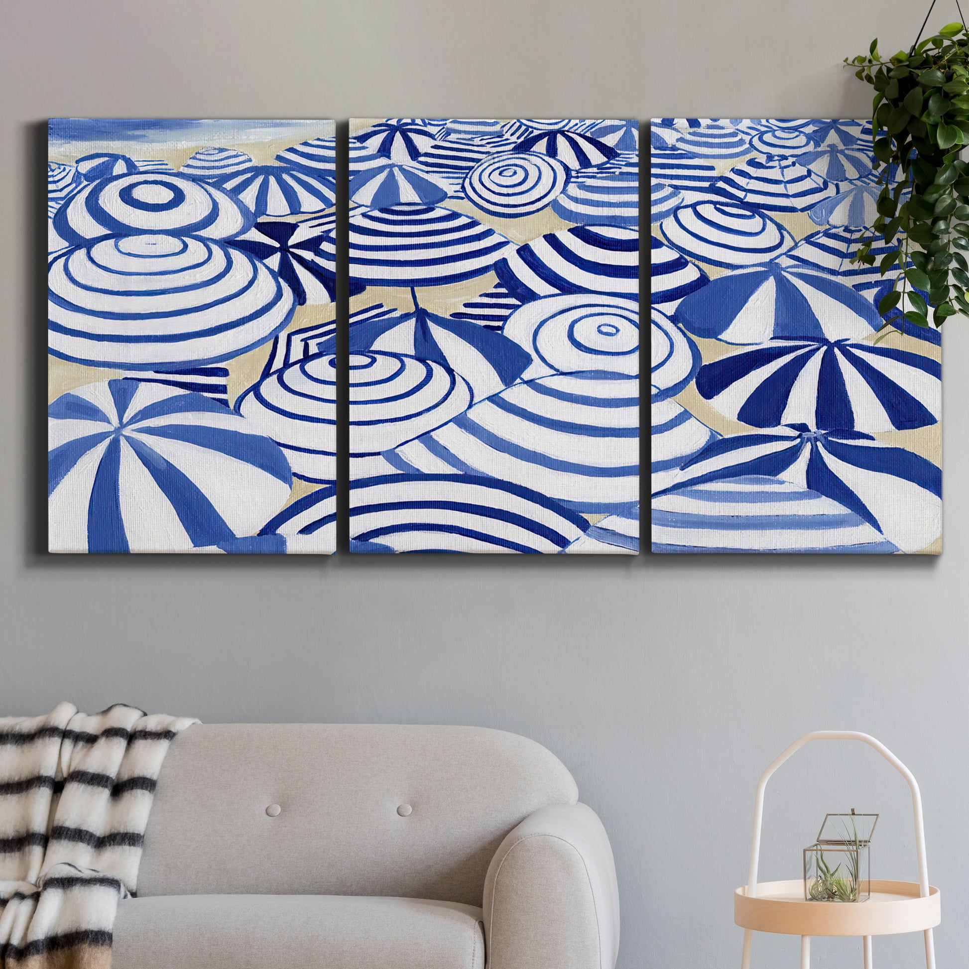 Three-panel canvas wall art featuring geometric abstract bowl forms, displayed in a modern living room above a sofa.