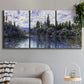 Three-panel canvas wall art featuring quiet river bend near village, displayed in a modern living room above a sofa.