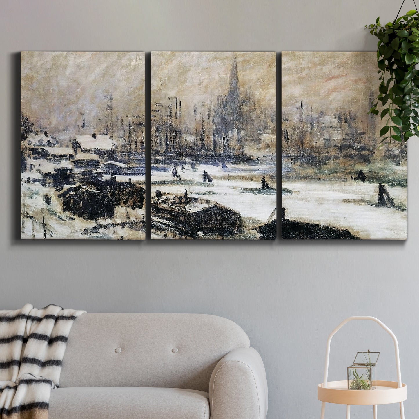 Three-panel canvas wall art featuring snowy village road in winter, displayed in a modern living room above a sofa.