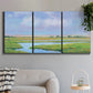 Three-panel canvas wall art featuring summer marshland with tall grasses, displayed in a modern living room above a sofa.