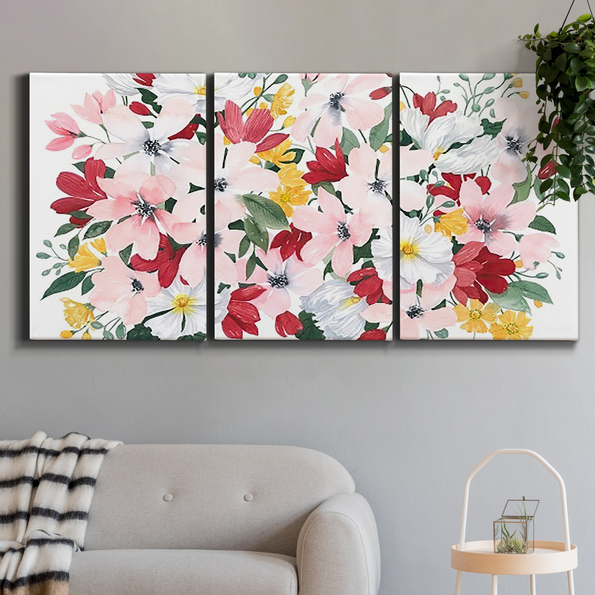 Three-panel canvas wall art featuring joyful spring floral composition, displayed in a modern living room above a sofa.
