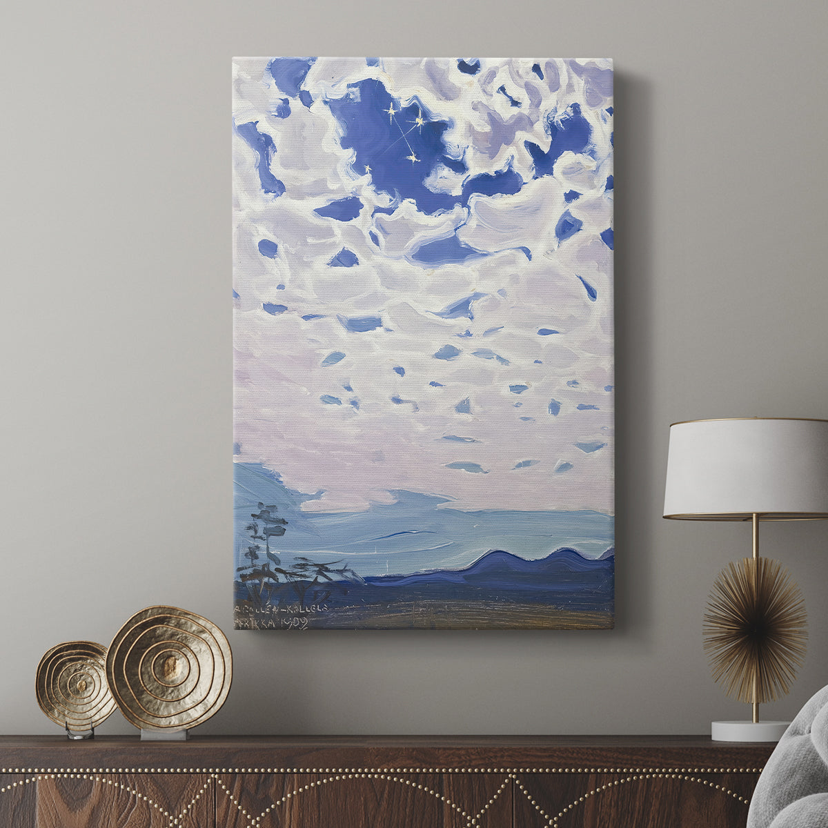 Canvas art print featuring a dramatic cloudscape under a bright night sky with visible stars displayed in a modern interior space.