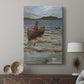 Canvas art print featuring a quiet maritime scene with a boat nearing land under soft light displayed in a modern interior space.