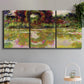 Three-panel canvas wall art featuring arched rose garden walkway, displayed in a modern living room above a sofa.