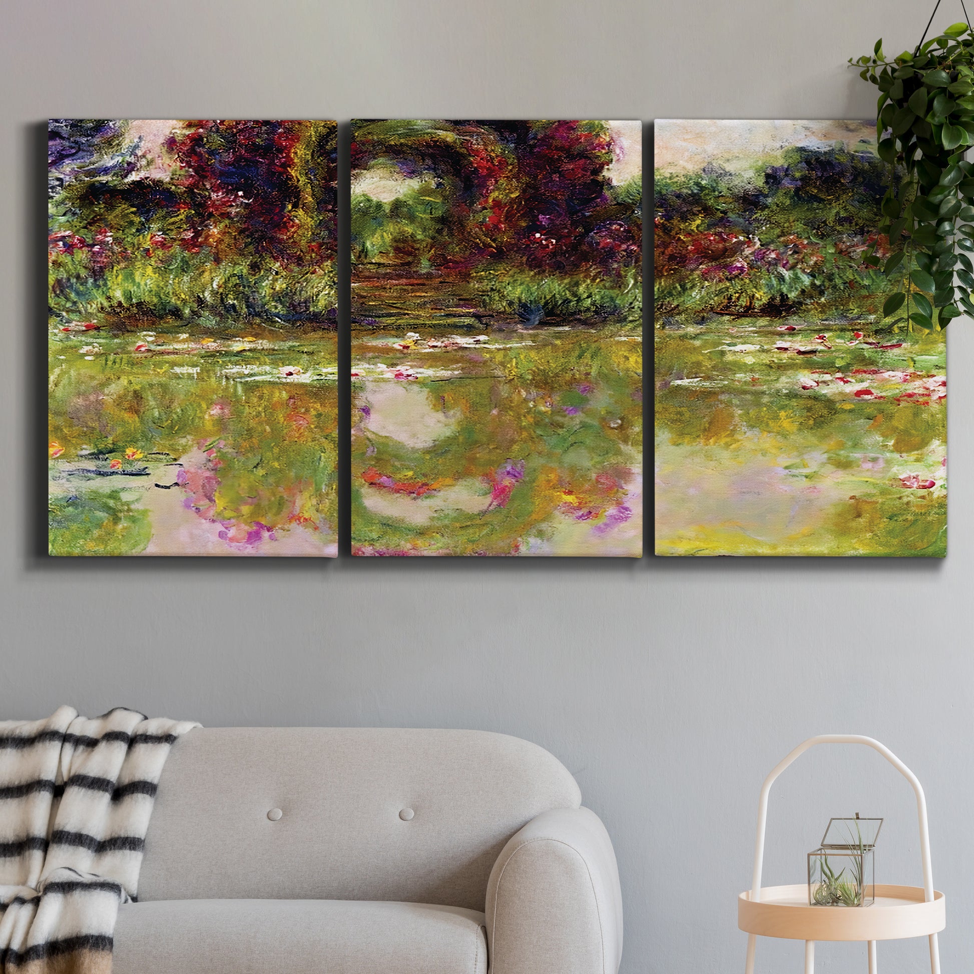 Three-panel canvas wall art featuring arched rose garden walkway, displayed in a modern living room above a sofa.