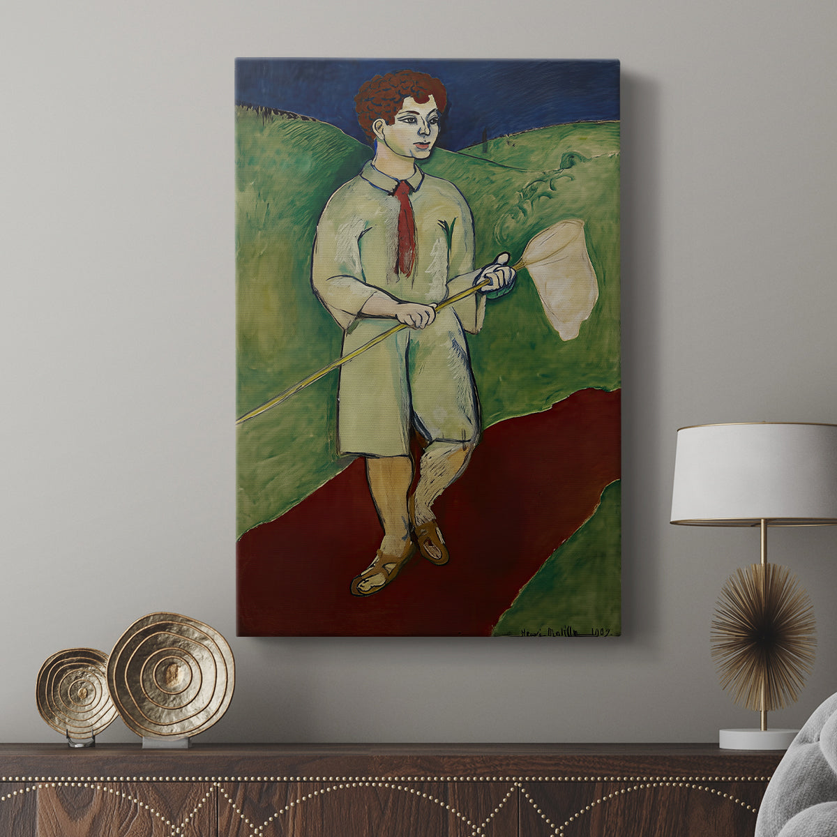 Canvas art print featuring a stylized figure with simple forms and vivid palette displayed in a modern interior space.