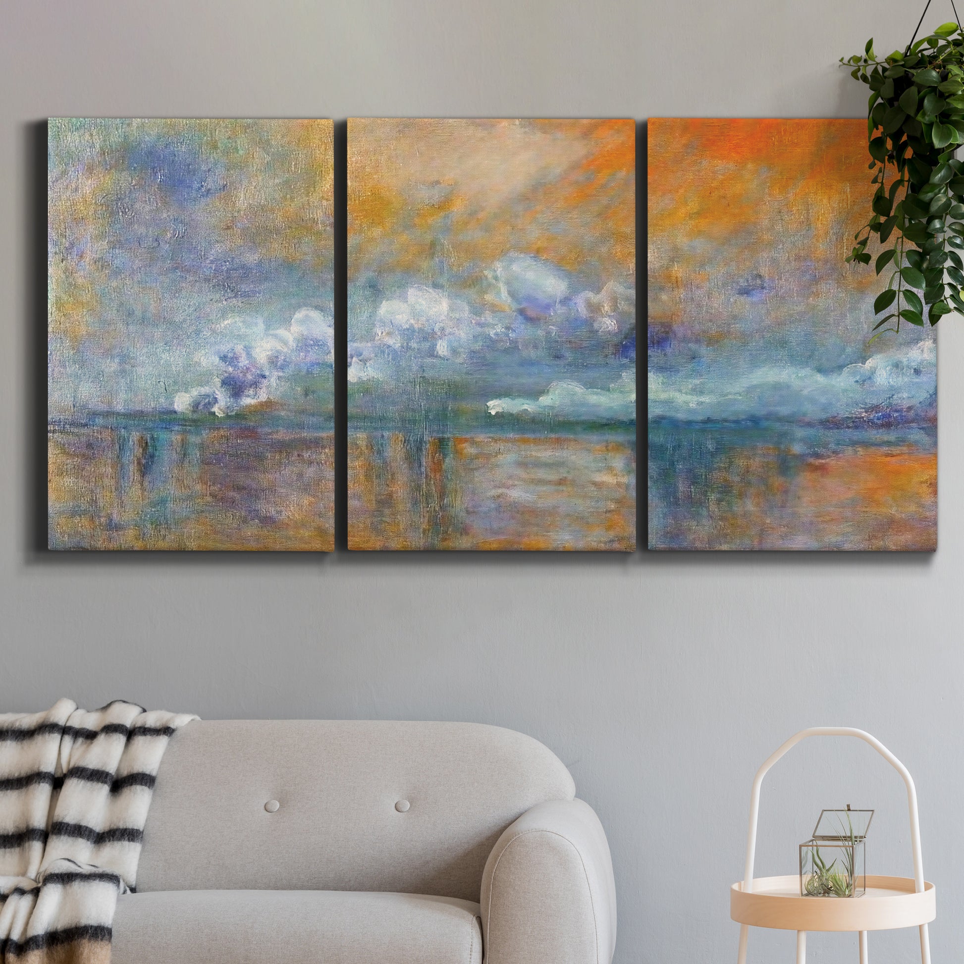 Three-panel canvas wall art featuring bridge shrouded in fog and smoke, displayed in a modern living room above a sofa.