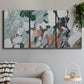 Three-panel canvas wall art featuring layered canyon inspired abstract forms, displayed in a modern living room above a sofa.