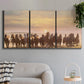Three-panel canvas wall art featuring running horses captured in motion, displayed in a modern living room above a sofa.
