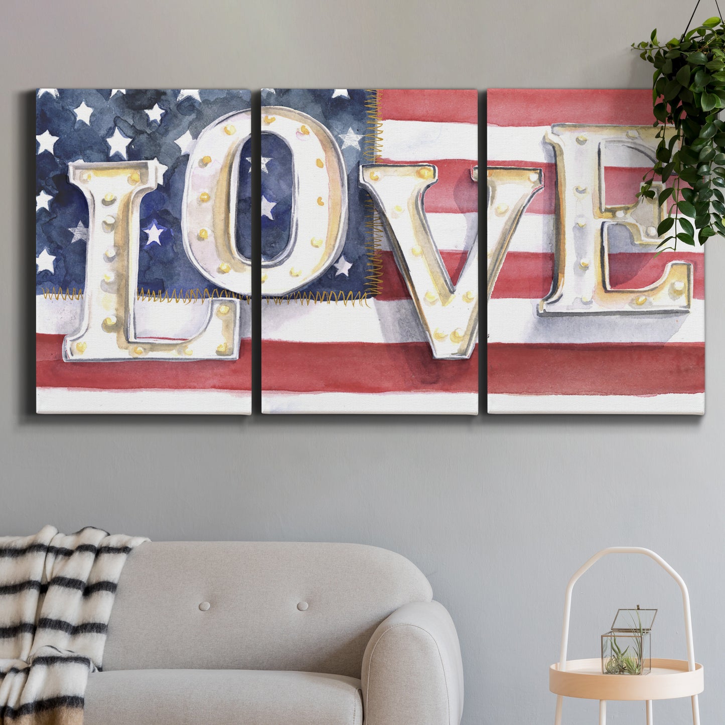 Three-panel canvas wall art featuring patriotic rustic typography art, displayed in a modern living room above a sofa.
