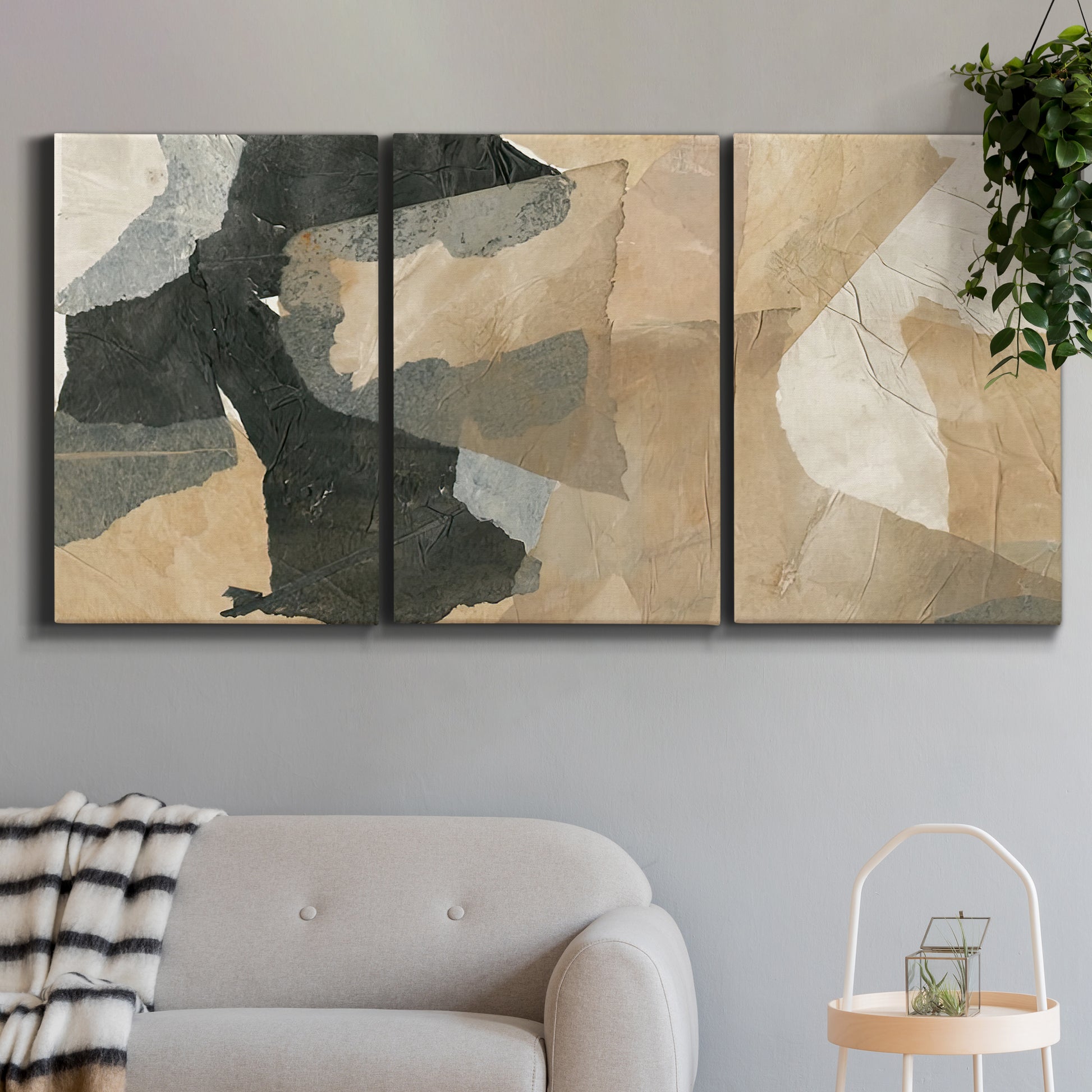 Three-panel canvas wall art featuring blurred mixed media abstract collage, displayed in a modern living room above a sofa.