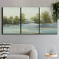 Three-panel canvas wall art featuring calming scenic landscape view, displayed in a modern living room above a sofa.
