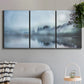 Three-panel canvas wall art featuring calm waters at sunrise photograph, displayed in a modern living room above a sofa.