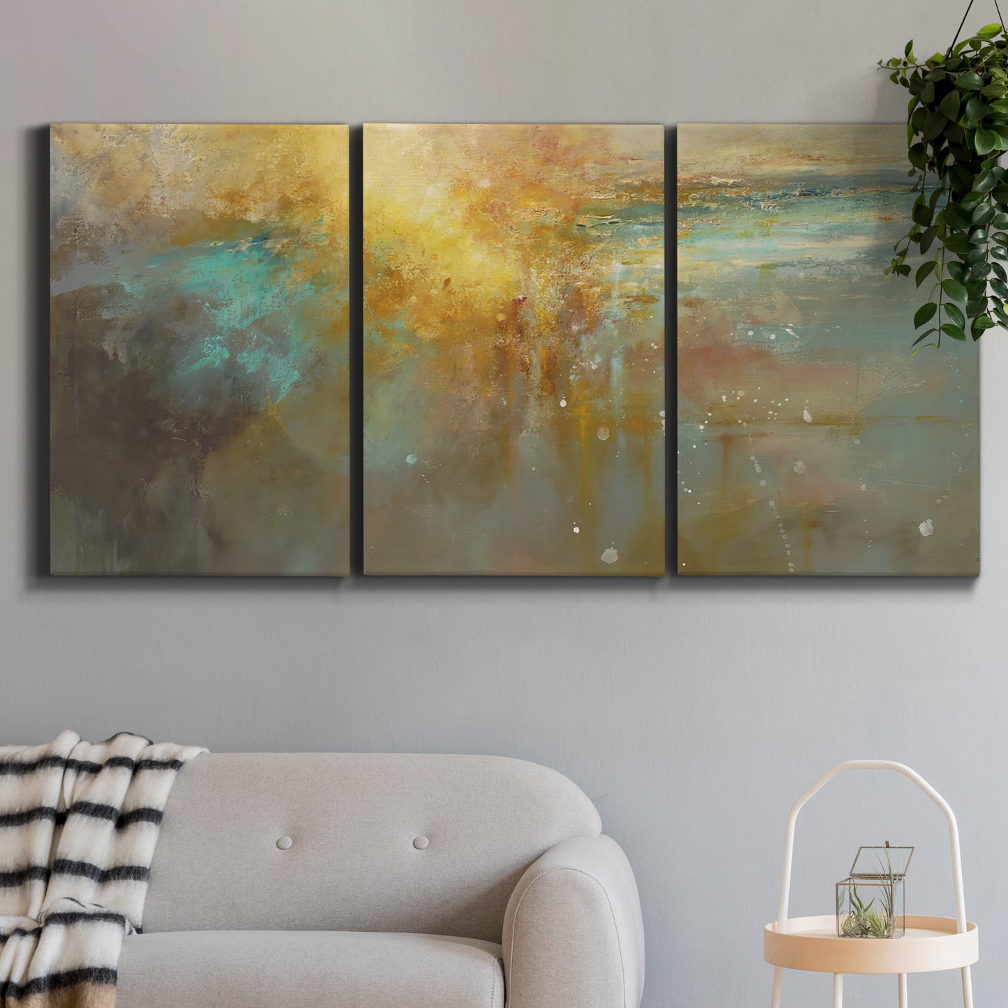 Three-panel canvas wall art featuring muted abstract river inspired tones, displayed in a modern living room above a sofa.