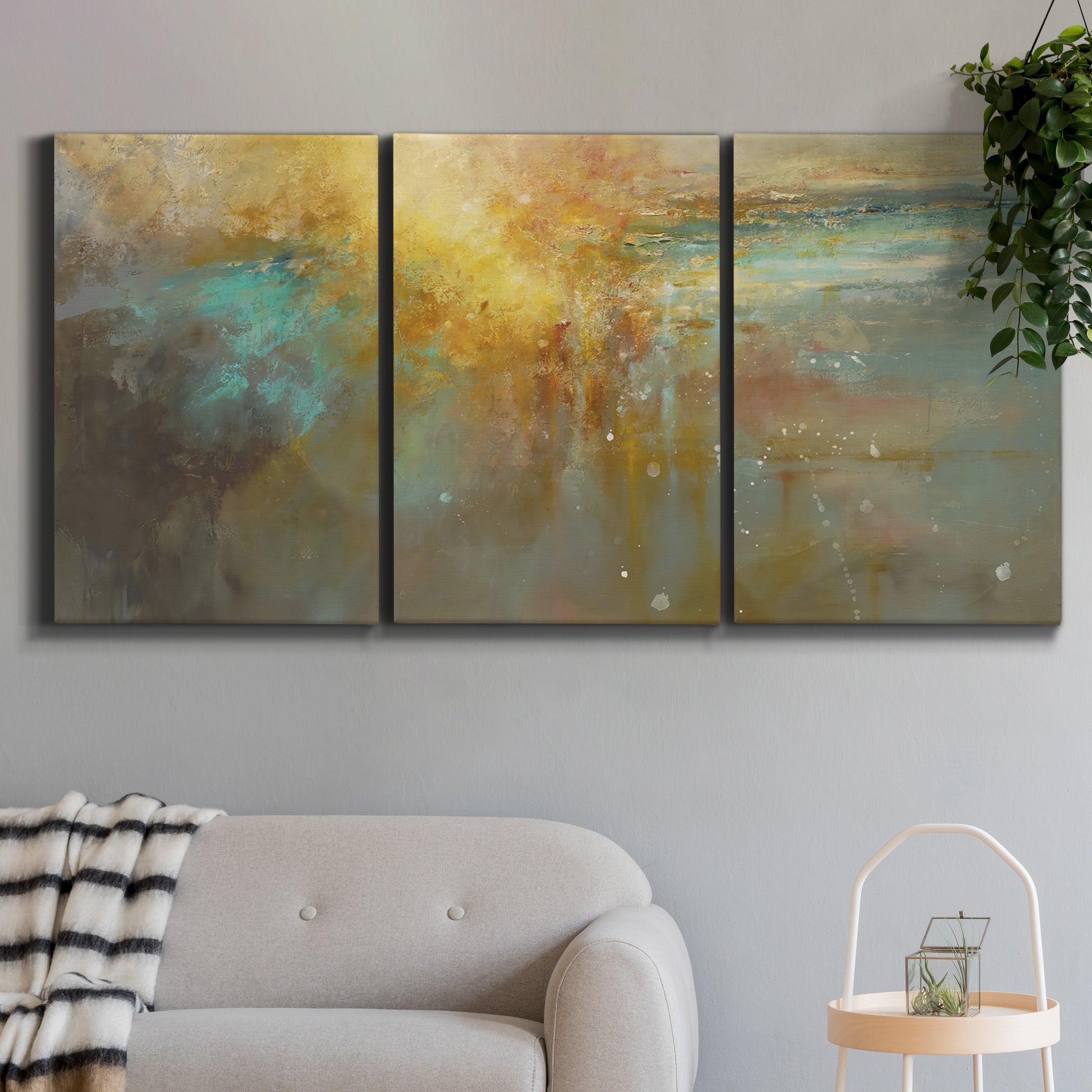 Three-panel canvas wall art featuring muted abstract river inspired tones, displayed in a modern living room above a sofa.