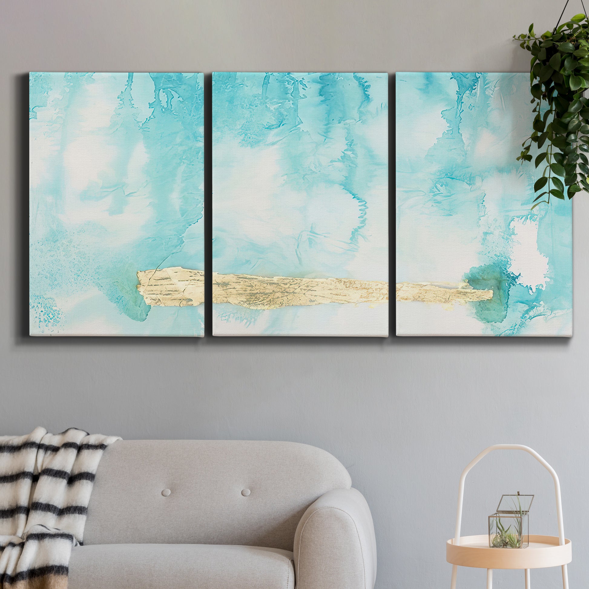 Three-panel canvas wall art featuring saturated abstract color fields, displayed in a modern living room above a sofa.