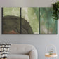 Three-panel canvas wall art featuring layered green abstract composition, displayed in a modern living room above a sofa.