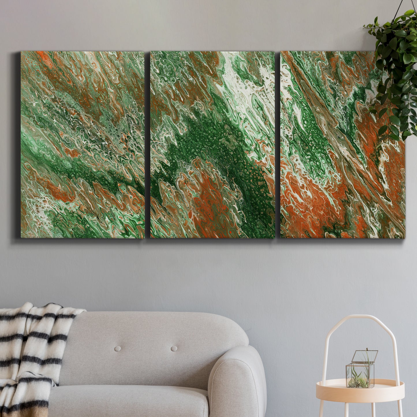 Three-panel canvas wall art featuring modern abstract layered pattern, displayed in a modern living room above a sofa.