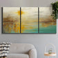 Three-panel canvas wall art featuring warm abstract end of summer palette, displayed in a modern living room above a sofa.
