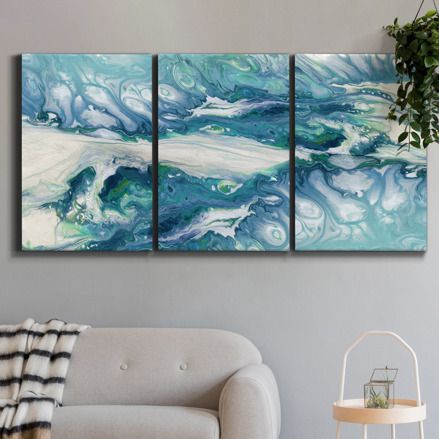 Three-panel canvas wall art featuring layered abstract marble textures, displayed in a modern living room above a sofa.