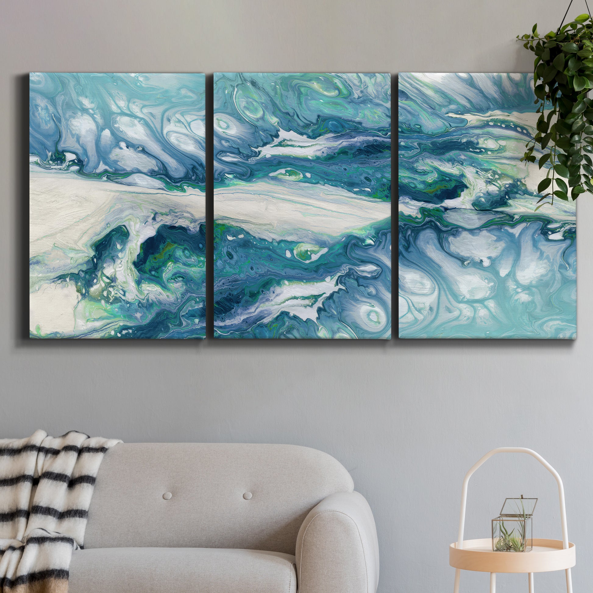 Three-panel canvas wall art featuring layered abstract marble textures, displayed in a modern living room above a sofa.