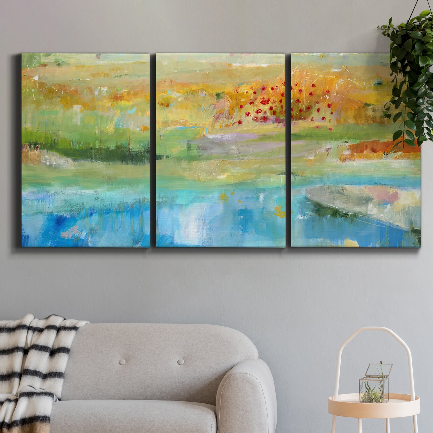 Three-panel canvas wall art featuring abstract sense of forward movement, displayed in a modern living room above a sofa.
