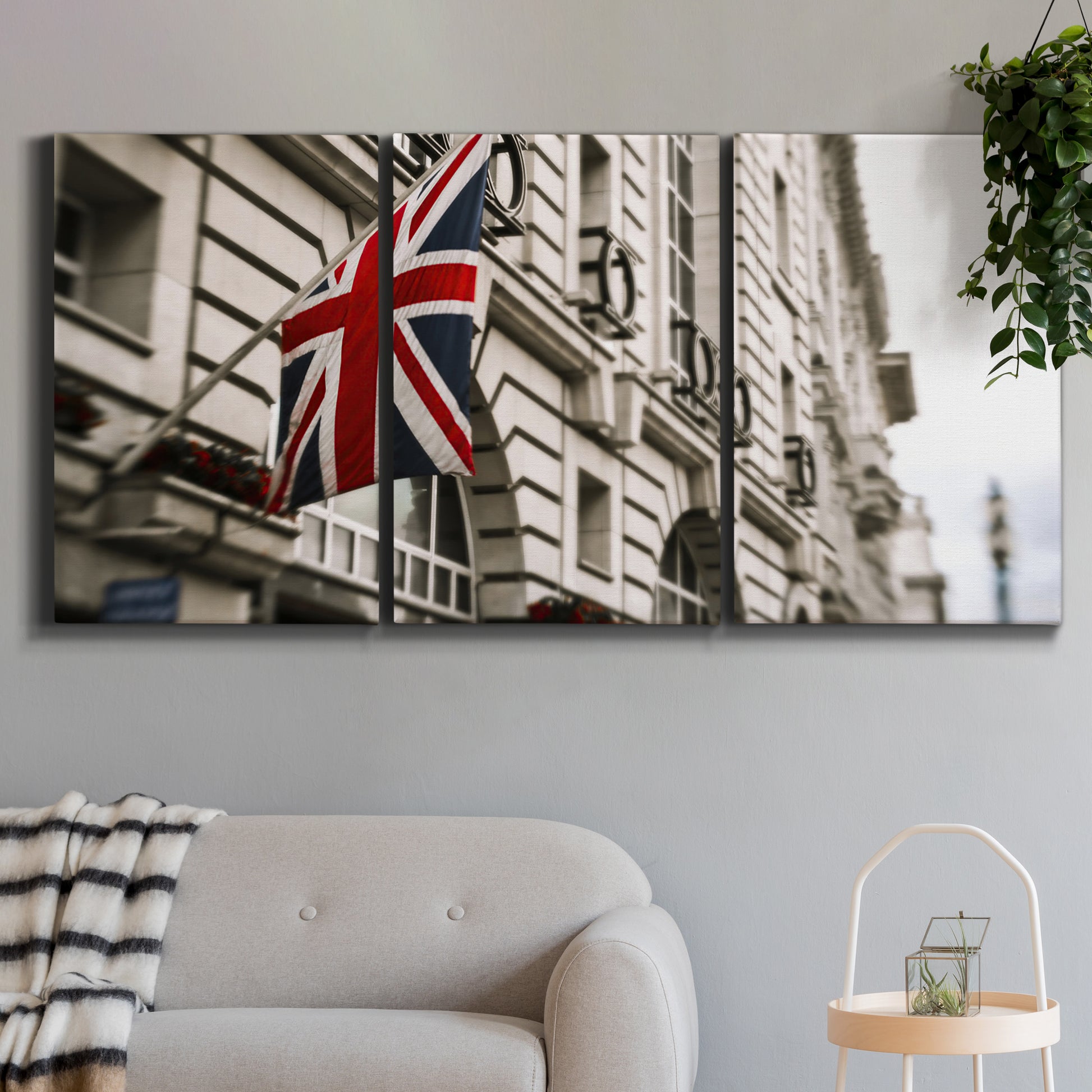 Three-panel canvas wall art featuring london street scene photograph, displayed in a modern living room above a sofa.