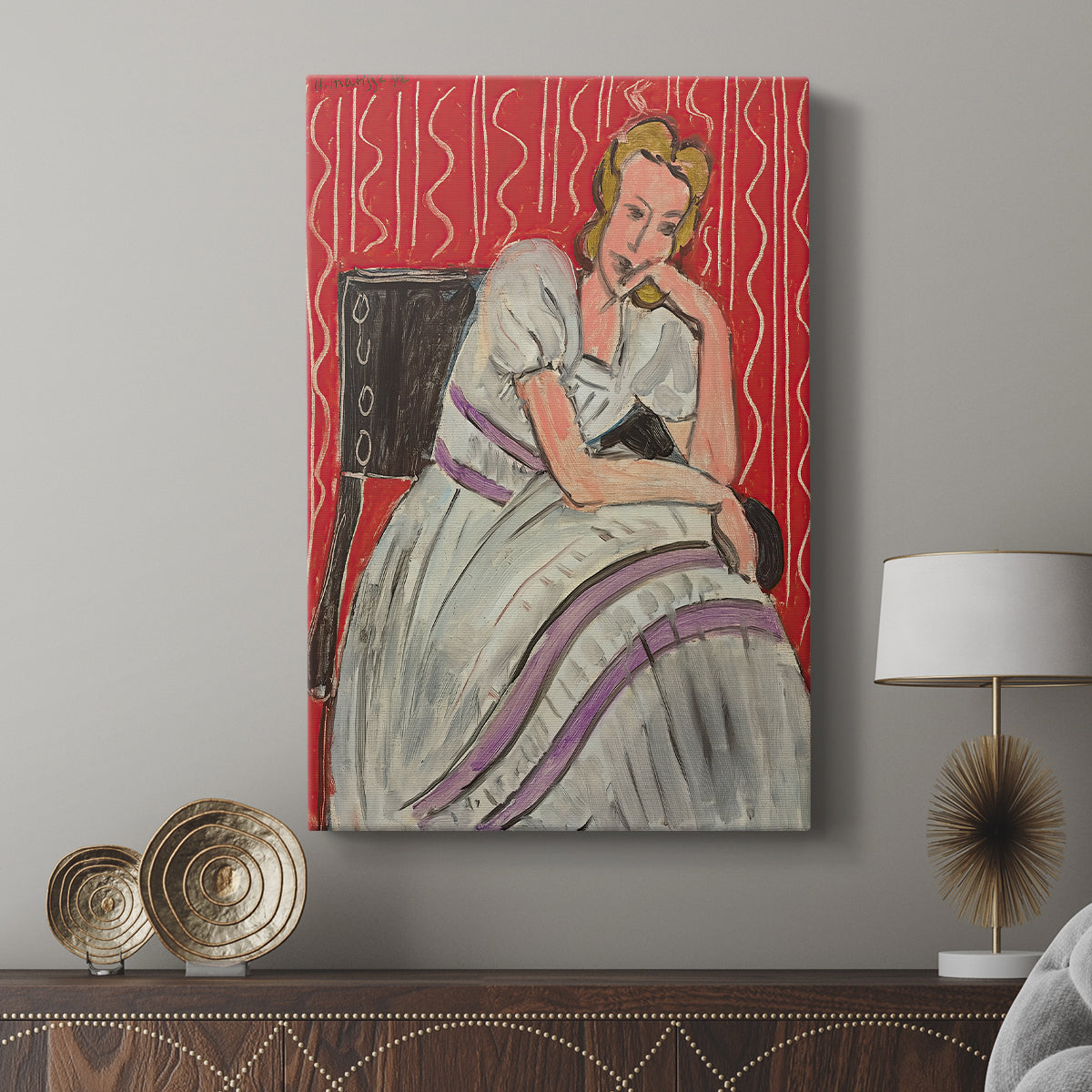 Canvas art print featuring a stylized portrait with minimal detail and balanced color displayed in a modern interior space.