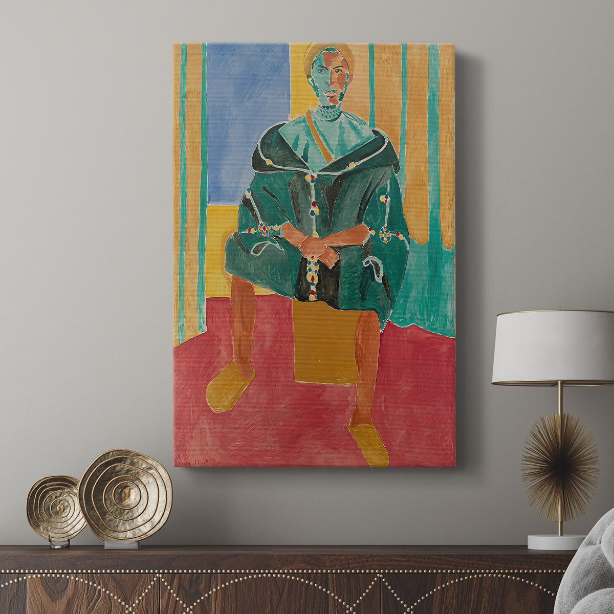 Canvas art print featuring a stylized portrait with decorative patterns and strong color displayed in a modern interior space.