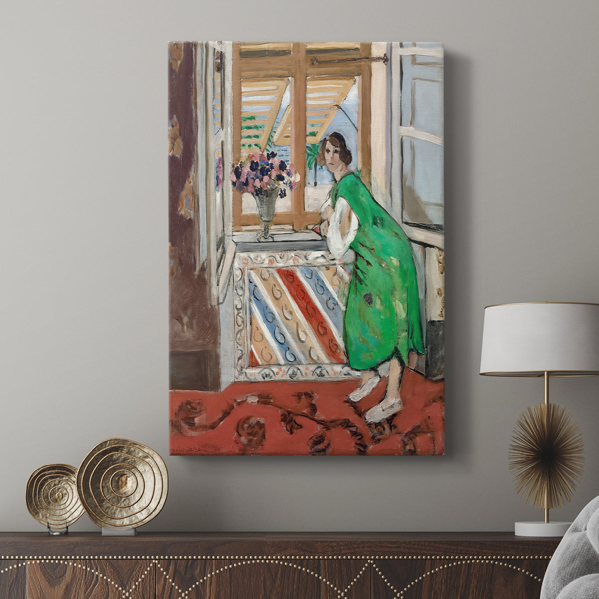 Canvas art print featuring a portrait with bold tones and simplified features displayed in a modern interior space.
