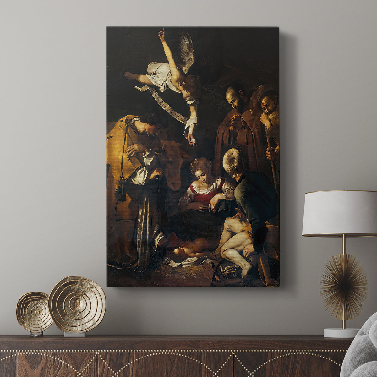 Canvas art print featuring a devotional scene with earthy tones and subtle detail displayed in a modern interior space.