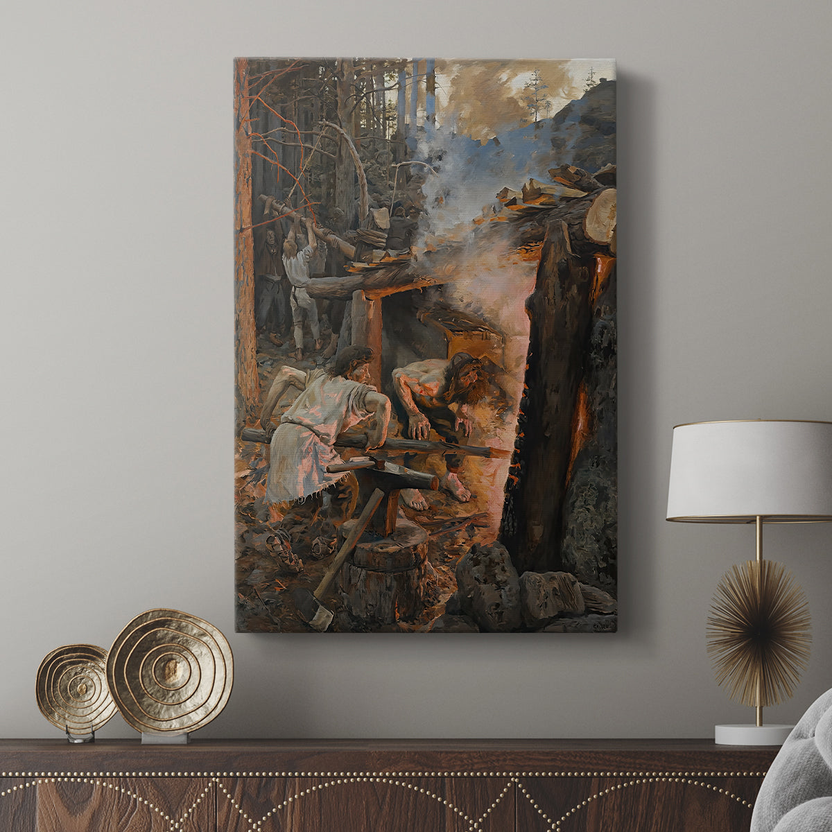 Canvas art print featuring a heroic myth scene with figures crafting an object amid sparks and fire displayed in a modern interior space.