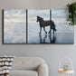 Three-panel canvas wall art featuring running horses captured mid stride, displayed in a modern living room above a sofa.