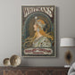 Canvas art print featuring a decorative poster with elegant lines and soft color palette displayed in a modern interior space.
