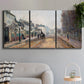 Three-panel canvas wall art featuring tree lined boulevard in town, displayed in a modern living room above a sofa.