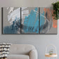 Three-panel canvas wall art featuring playful abstract mark making, displayed in a modern living room above a sofa.