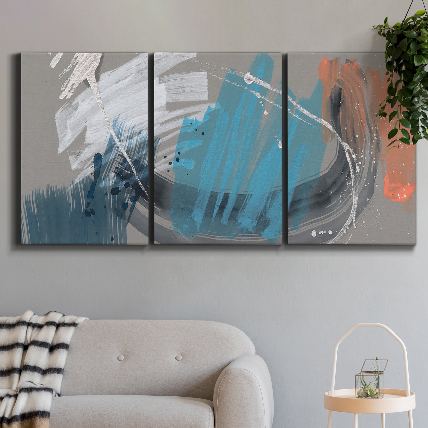Three-panel canvas wall art featuring playful abstract mark making, displayed in a modern living room above a sofa.