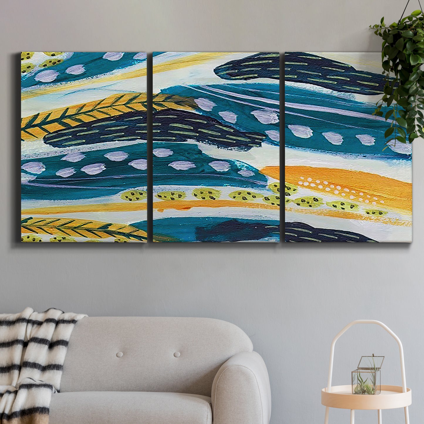 Three-panel canvas wall art featuring feather inspired abstract linear motion, displayed in a modern living room above a sofa.