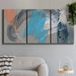 Three-panel canvas wall art featuring playful abstract mark making, displayed in a modern living room above a sofa.