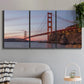 Three-panel canvas wall art featuring golden gate bridge spanning bay, displayed in a modern living room above a sofa.
