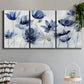 Three-panel canvas wall art featuring indigo floral blossoms awakening, displayed in a modern living room above a sofa.