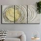 Three-panel canvas wall art featuring circular abstract energy forms, displayed in a modern living room above a sofa.