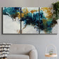 Three-panel canvas wall art featuring teal abstract paint splatter, displayed in a modern living room above a sofa.