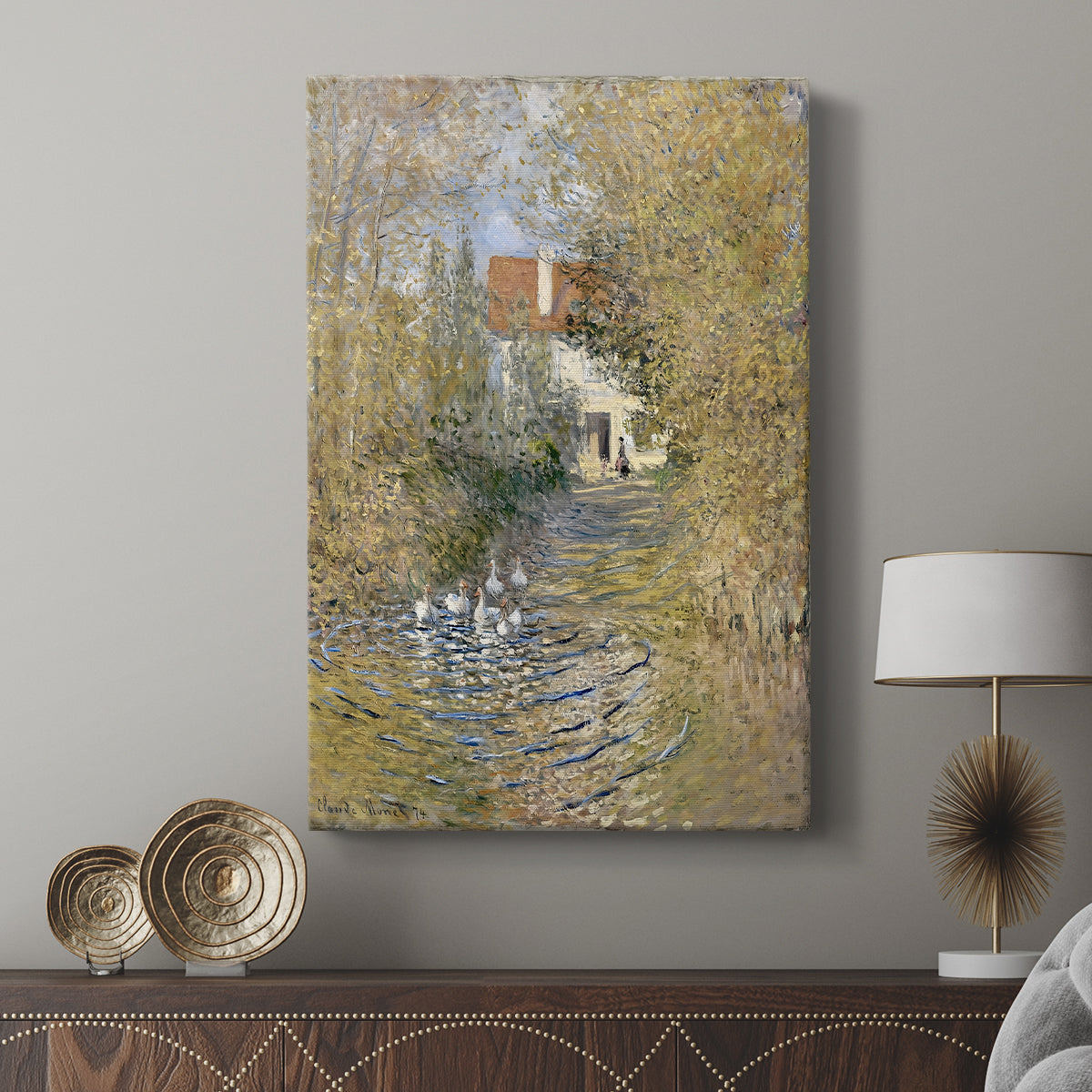Canvas art print featuring a countryside view with animals and muted tones displayed in a modern interior space.