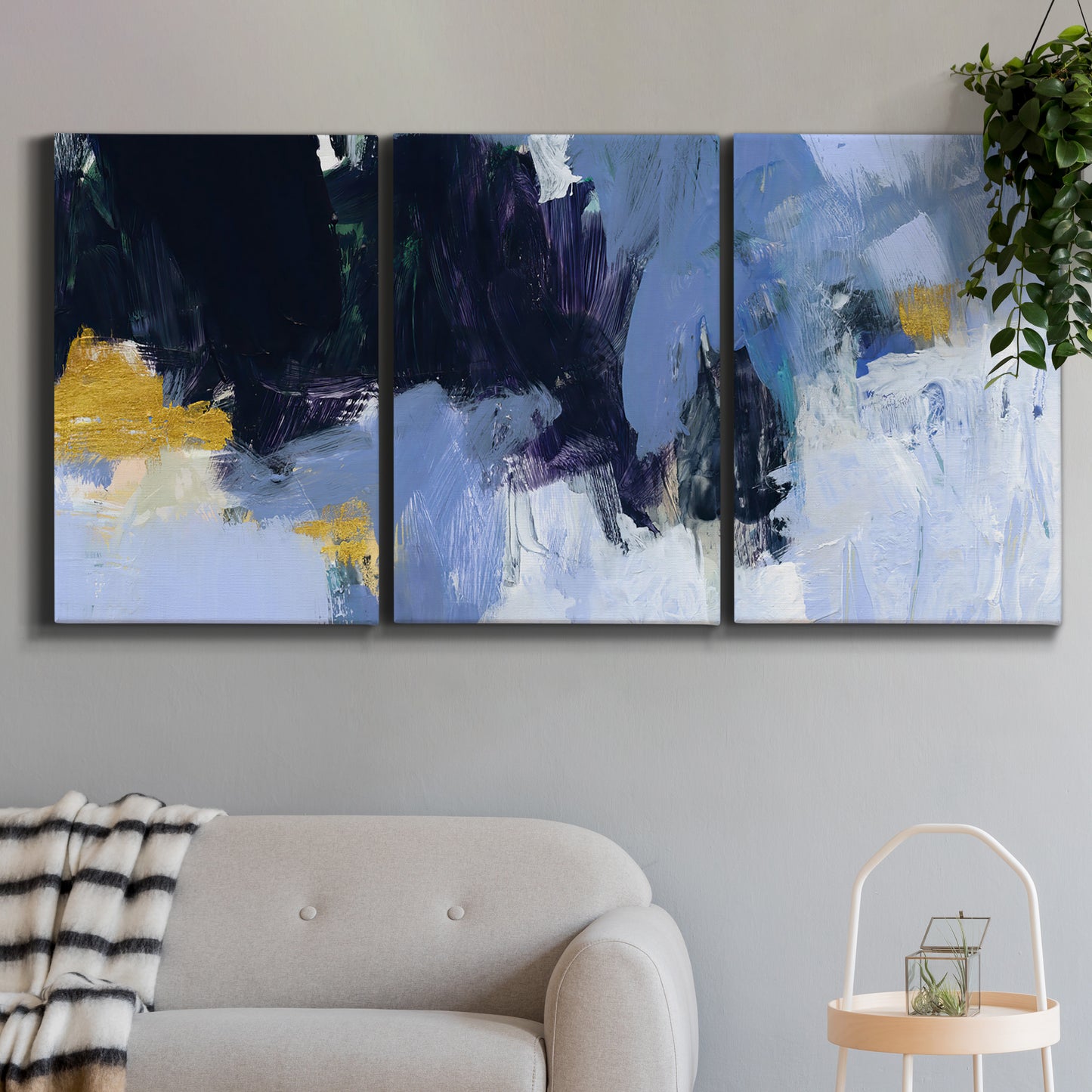 Three-panel canvas wall art featuring icy abstract arctic ledge, displayed in a modern living room above a sofa.