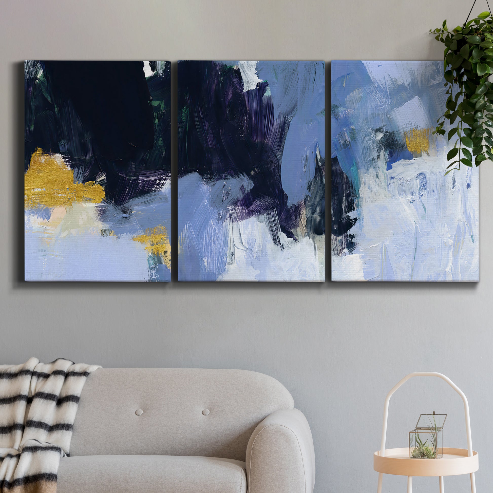 Three-panel canvas wall art featuring icy abstract arctic ledge, displayed in a modern living room above a sofa.