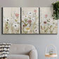Three-panel canvas wall art featuring loose farmhouse style floral painting, displayed in a modern living room above a sofa.