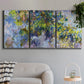 Three-panel canvas wall art featuring cascading purple wisteria blooms, displayed in a modern living room above a sofa.