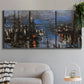 Three-panel canvas wall art featuring Le Havre port at night with lights, displayed in a modern living room above a sofa.